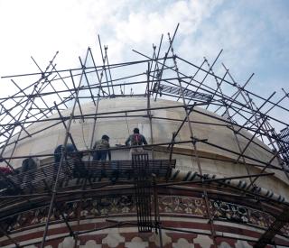 Workers cleaning Taj Mahal