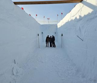 The team standing in the research trench.