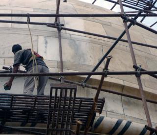 Worker cleaning Taj Mahal